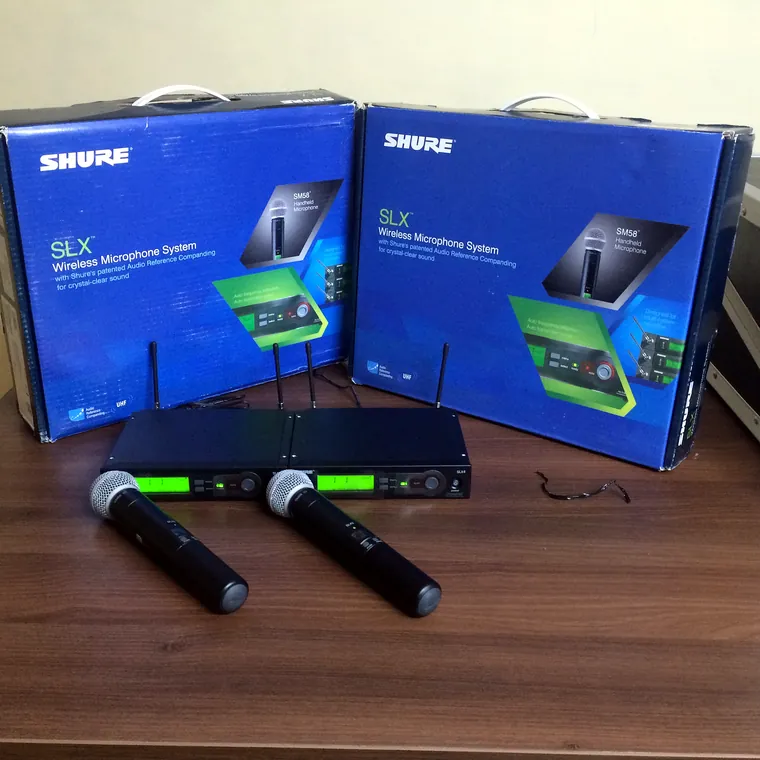 Shure SLX wireless microphone kits with boxes